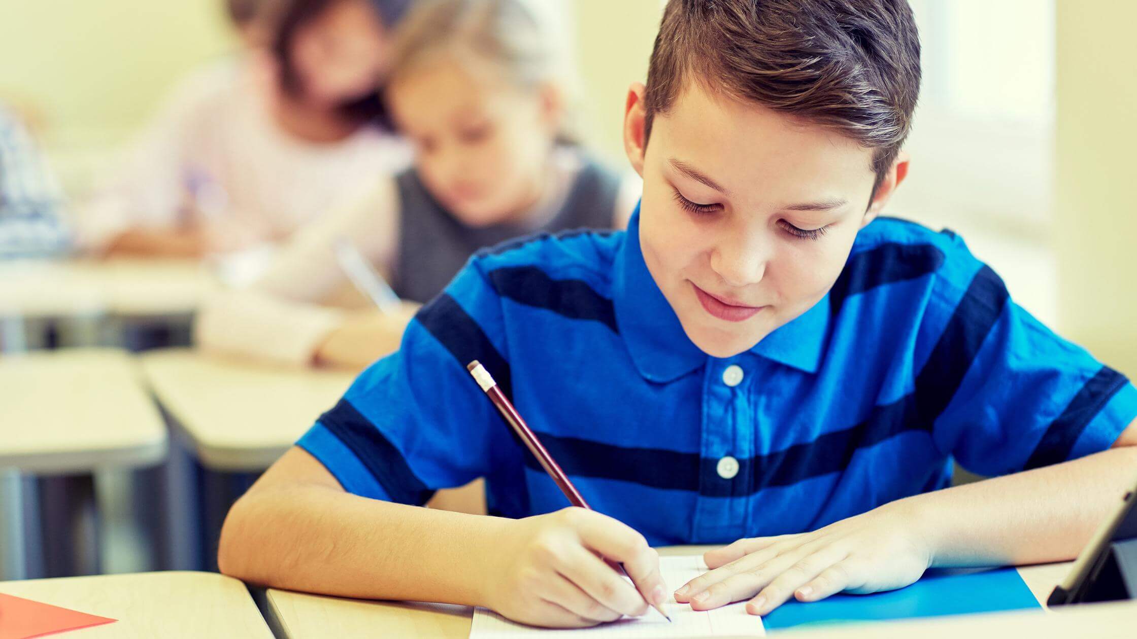 Image of middle school student doing a sentence dictation activity